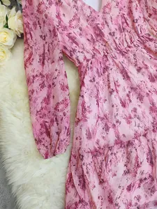 Detail view of Bohemian V-neck long-sleeve dress with pink marble print pattern