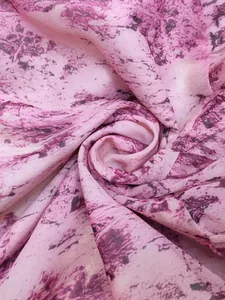 Detailed macro view of bohemian pink and purple abstract marble print fabric texture