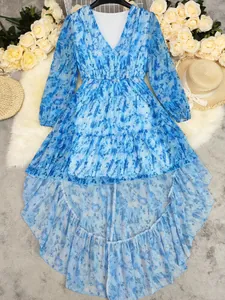 Detailed view of bohemian blue tie-dye printed dress featuring irregular high-low hem