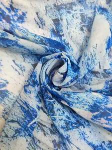 Macro view of blue and white abstract marble print fabric for bohemian dress