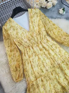 Detail of Bohemian V-neck long sleeve floral print maxi dress in yellow hue
