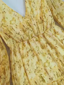 Macro detail showing texture of Bohemian V-neck long sleeve floral print maxi dress