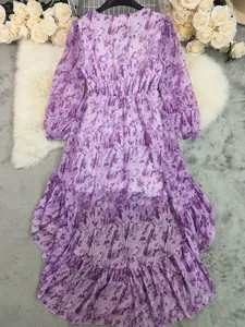 Detail view of Bohemian V-neck long sleeve dress with irregular hem and purple print