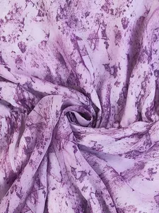 Close-up detail of bohemian purple and white marbled pattern fabric for long sleeve dress
