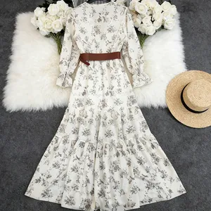 Elegant bohemian white floral long sleeve maxi dress with V-neck and brown waist belt