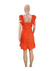 Back view of a red polka dot mini dress with ruffled flutter sleeves and high waist