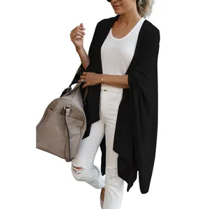 Elegant black women's long knit cardigan featuring a stylish asymmetric hem and relaxed fit design