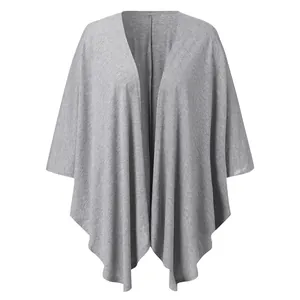 Detailed view of a grey knitted cardigan with irregular hem and open-front design