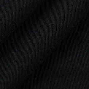 Macro view of the soft black knitted fabric texture on the long sleeve cardigan.