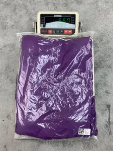 Purple one-shoulder jumpsuit shown in packaging on a digital scale for weight verification.