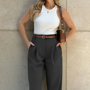 Detailed view of elegant high-waisted dark grey trousers with a stylish brown belt