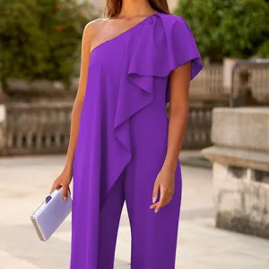 Close-up detail of a purple one-shoulder jumpsuit featuring elegant ruffle decoration