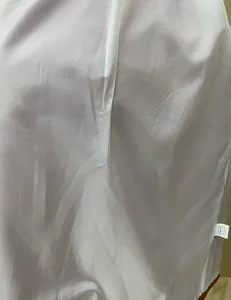 Detailed view of the smooth inner lining and size tag of a women's blazer