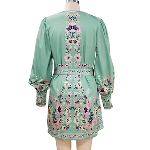 Detailed back view of a mint green Bohemian floral printed long-sleeve dress with belt.