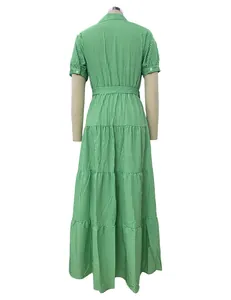 Full back view of a green and white vertical striped tiered short sleeve maxi dress