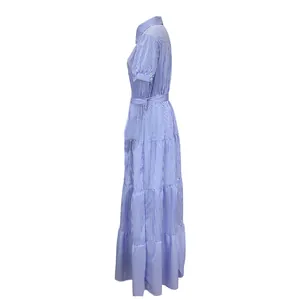 Side profile of a blue and white striped short sleeve maxi dress with belted waist