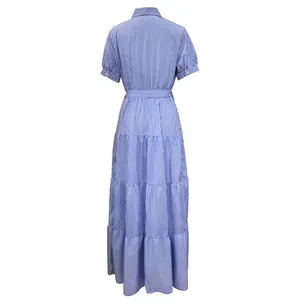 Back view detail of a blue and white striped short sleeve maxi dress with tiered skirt.