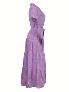 Side view detail of a purple and white striped short sleeve tiered maxi dress for women