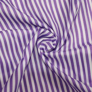 Close-up detail showing the purple and white striped fabric texture of a summer dress.