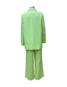 Back view of neon green two-piece blazer and trouser set for women's casual wear