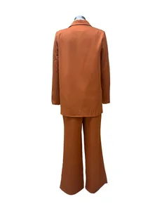 Back view of a rust orange two-piece suit set with blazer and wide-leg pants