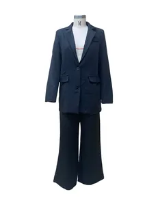 Detailed view of professional women's black two-piece suit set on a mannequin