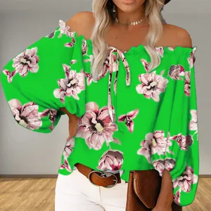 Close-up of vibrant green off-shoulder floral print top featuring elegant puff sleeves