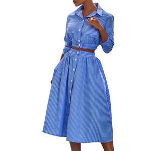 Detail view of stylish blue and white striped cropped shirt and midi skirt two-piece set