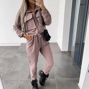 Stylish mauve two-piece tracksuit set with zip-up top and jogger pants for women