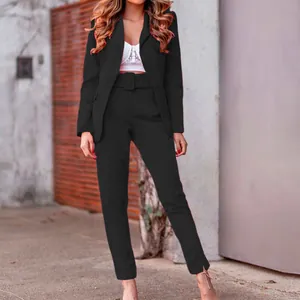 Detailed view of elegant black women's long-sleeve blazer and matching belted trouser set