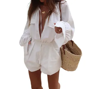 Elegant white cotton linen long sleeve romper featuring deep v-neck and casual chest pockets