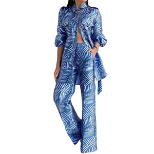 Full view of blue tropical leaf print two-piece set with shirt and wide-leg pants