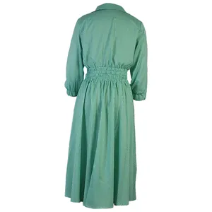 Back view of a fashionable green and white striped long sleeve shirt and skirt two-piece set