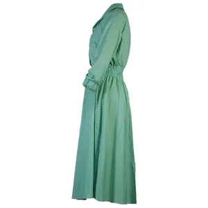 Elegant green and white striped long-sleeve shirt dress featuring a pleated waist detail