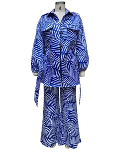 Close-up detail of women's blue and white palm leaf print long sleeve shirt and trousers set