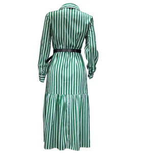 Back view of a green and white vertical striped long sleeve midi dress with belt.