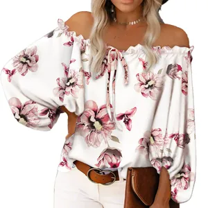 Elegant close-up view of off-the-shoulder floral print blouse with ruffle details
