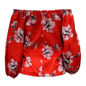 Detailed view of a vibrant red floral off-shoulder blouse with elegant long puff sleeves.