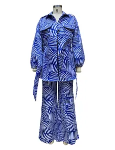 Detailed view of women's two-piece set with blue palm leaf print
