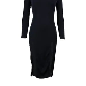 Detailed view of the black ribbed slim-fit dress with high neck and double side slits.