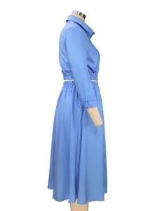 Side view detail of stylish blue and white striped long sleeve shirt and skirt set
