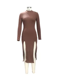 Detail of a brown ribbed mock neck dress featuring stylish double front slits and long sleeves.