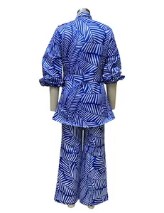 Back view of women's blue and white palm leaf print two-piece top and pants set