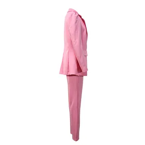 Side profile view of elegant pink women's two-piece blazer and trousers suit set