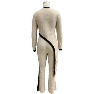 Back view of beige textured two-piece set with black contrast trim and wrap design