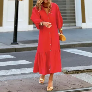 Full-length view of a vibrant red loose-fit dress with stylish puff sleeves on a city street