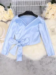 Elegant light blue satin V-neck blouse with long sleeves and large waist bow detail.