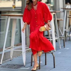 Detail view of stylish red puff sleeve vacation dress in loose mid-length cut