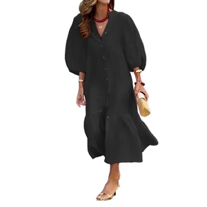 Elegant black puff sleeve midi dress with button-down front for a relaxed resort look.