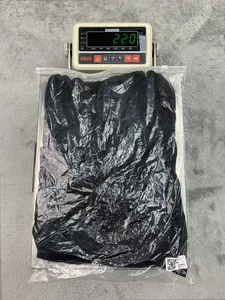 Product weight verification for black cotton linen dress showing 220g on digital scale